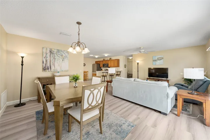 View from FRONT DOOR - DINING ROOM (front L), LIVING ROOM (back R), and eat-in KITCHEN (back Center)