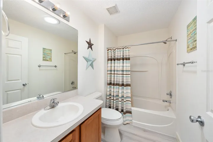 View of BATHROOM #2 - Shows single sink/vanity, comfort height toilet, and TUB/SHOWER COMBO