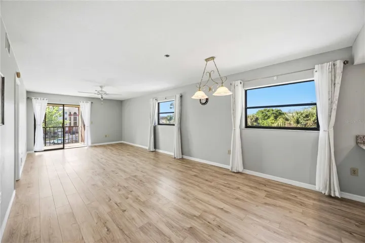 Large open living room and dining room with lots of natural light.