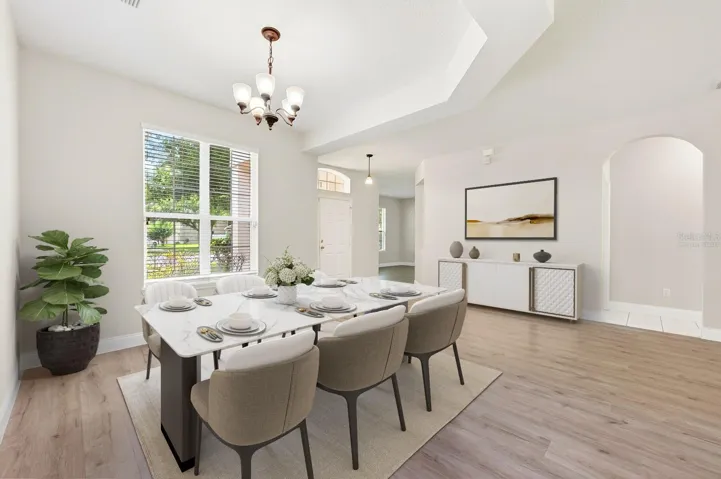 The foyer opens up to a formal dining space ideal for entertaining family and friends. Virtually Staged.