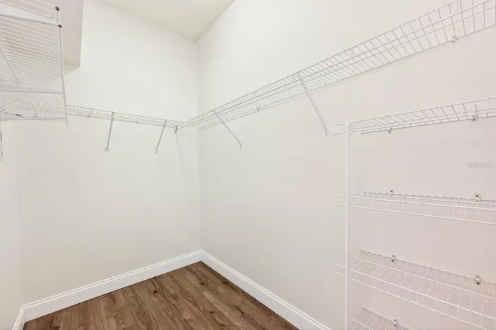 Primary suite walk-in closet.