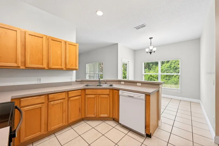 Kitchen is open to a casual breakfast nook.