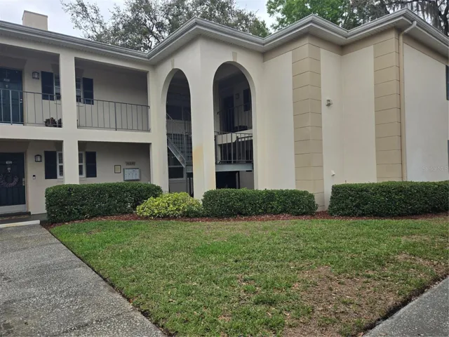 front of bldg showing stairs to unit