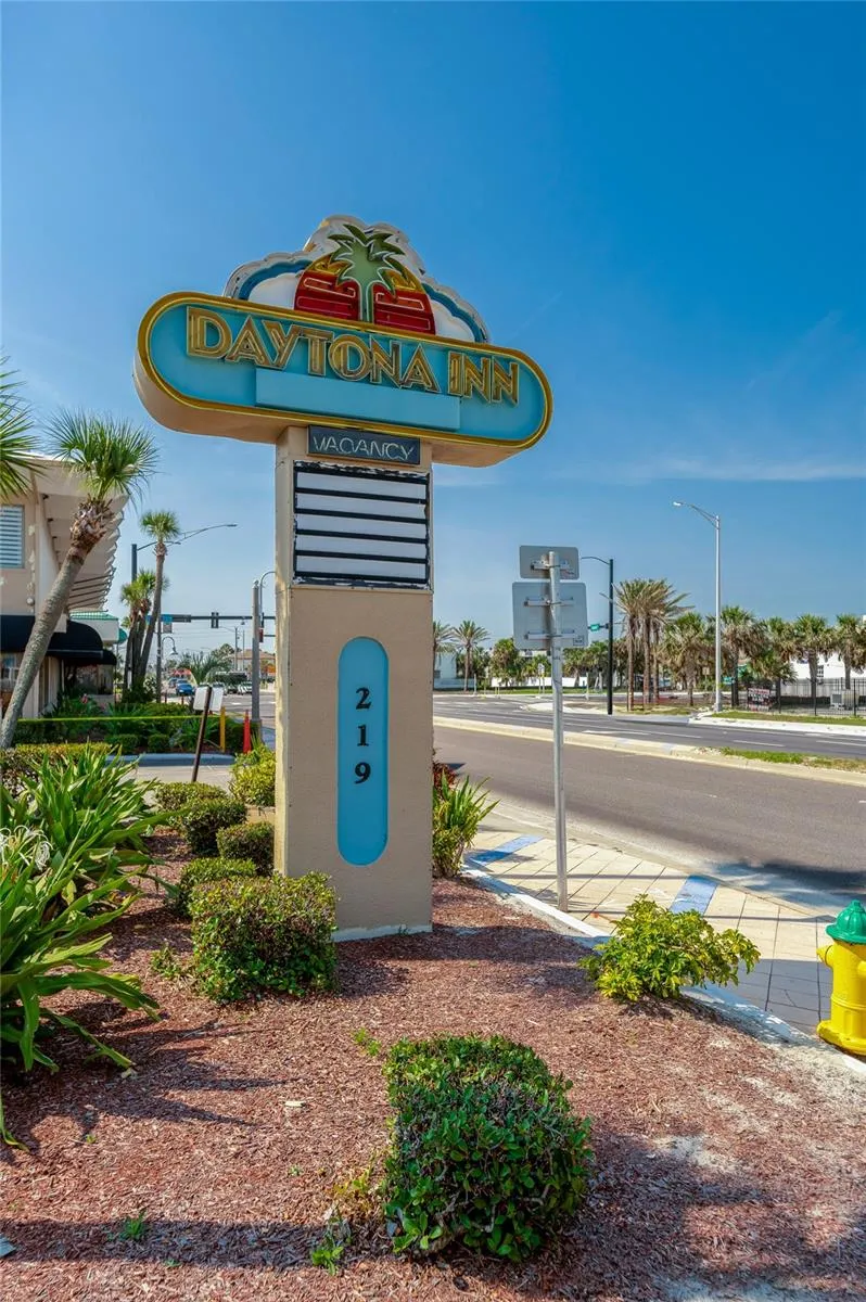 Front signage and landscaped entry add recognizable curb appeal along Atlantic Avenue.