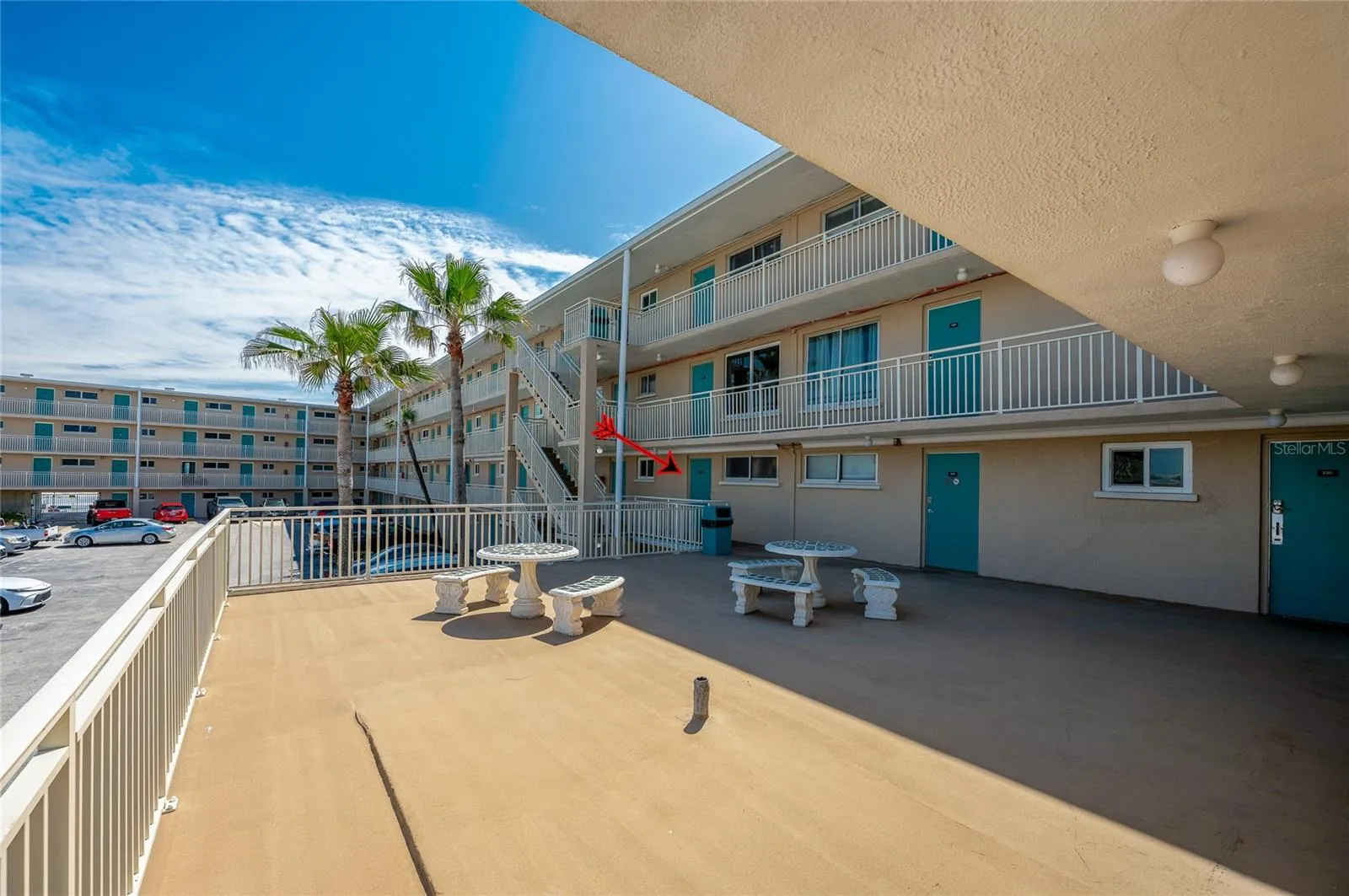 Shared deck and exterior corridor offer convenient access to the unit while creating an inviting outdoor common space.