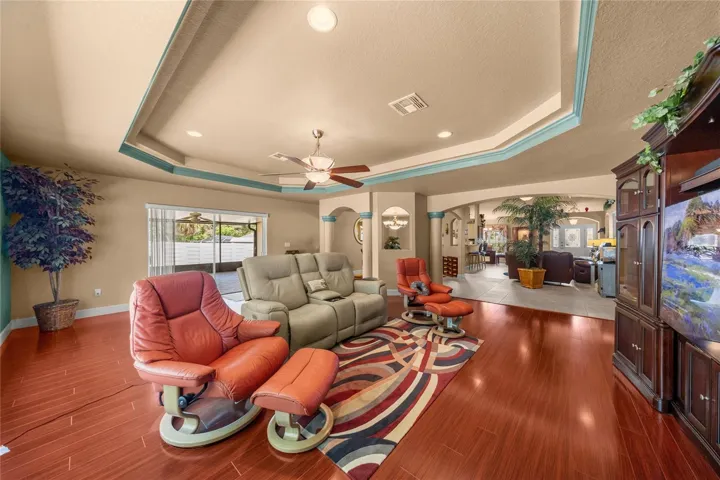 MEDIA ROOM, SLIDERS TO LANAI, OPENS TO LIVING ROOM & FORMAL DINING ROOM