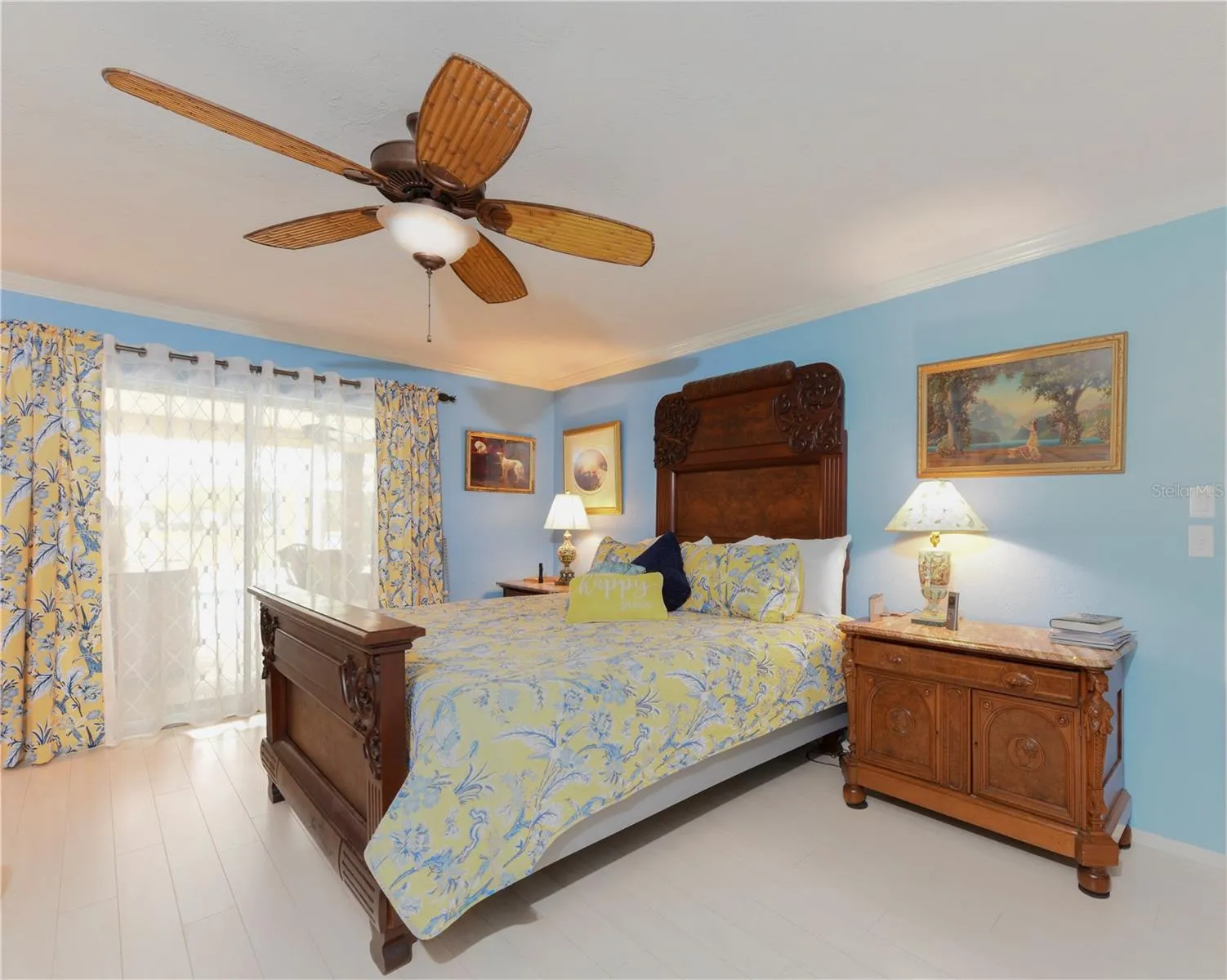 Primary bedroom with sliders to pool area