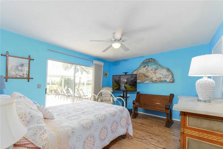 Third bedroom with sliders out to the pool and walk in closet.