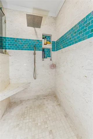 Primary bath shower with rain head and hand held shower head.