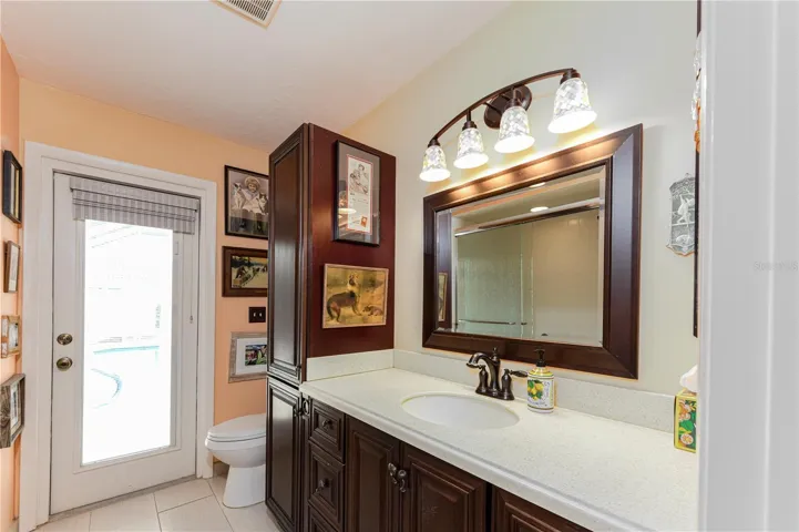 Second bathroom with shower and access to pool