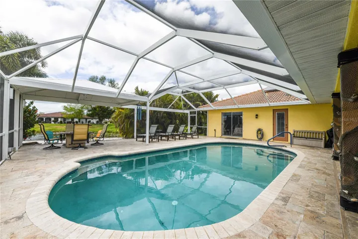 Large pool, fire pit and covered area for the outside kitchen