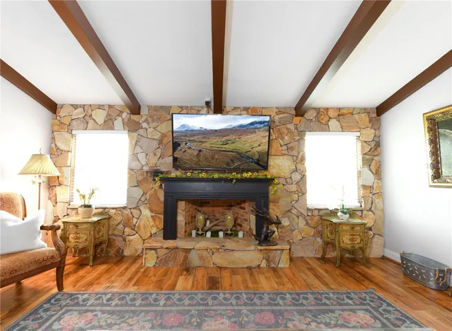 Family room with fireplace and vaulted ceiling