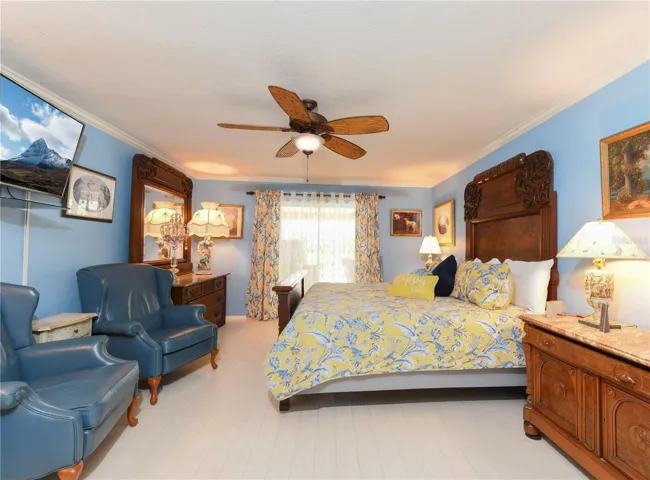 Primary Bedroom with sliders to pool area