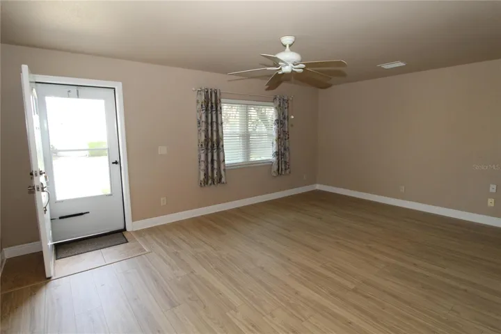 Living room, warm and inviting with luxury vinyl plank flooring.