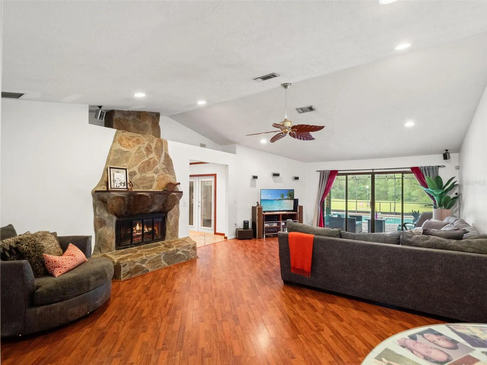 Expansive Family Room with Stone Fireplace