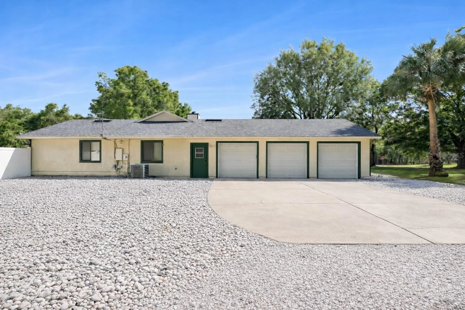 3 Car garage with New expanded gravel parking for RV/boat/trailer.