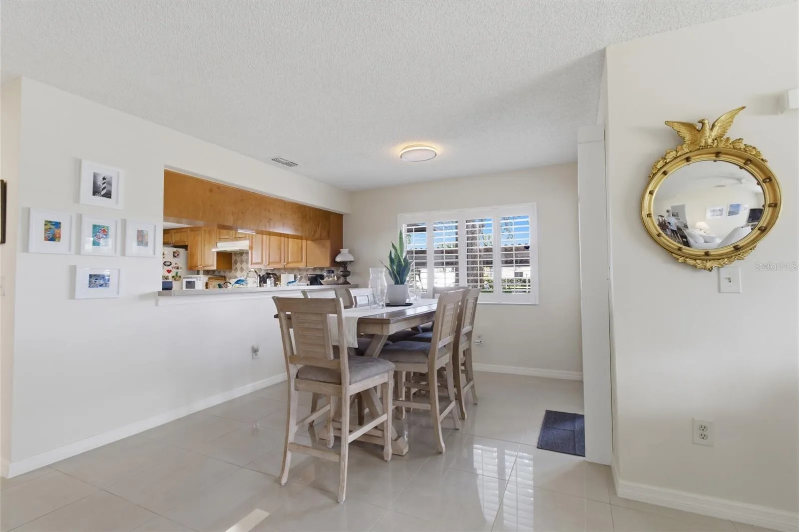 Dining Room with Sliders to front enclosed Patio