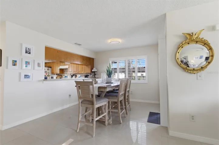 Dining Room with Sliders to front enclosed Patio