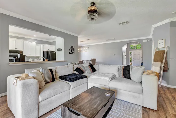 Living area facing into kitchen and dining area.