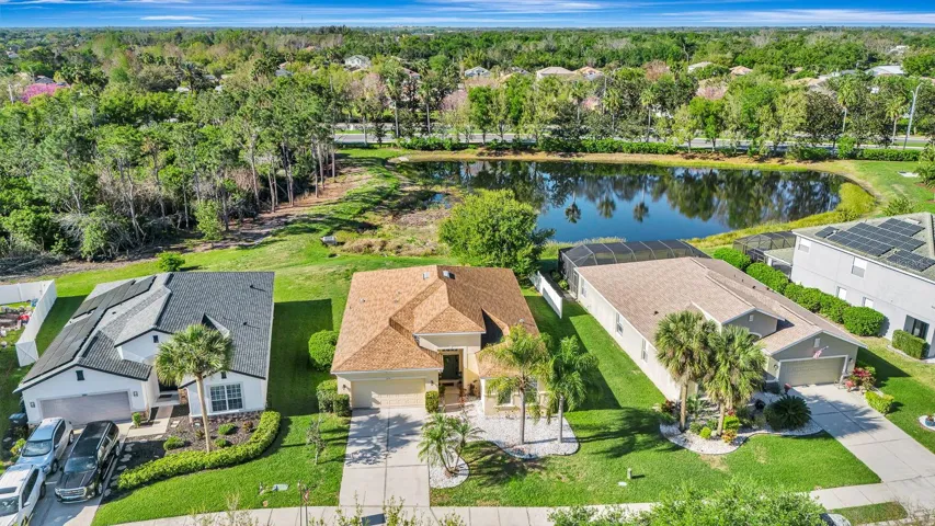 Another view from font of home showing preserve and lake.