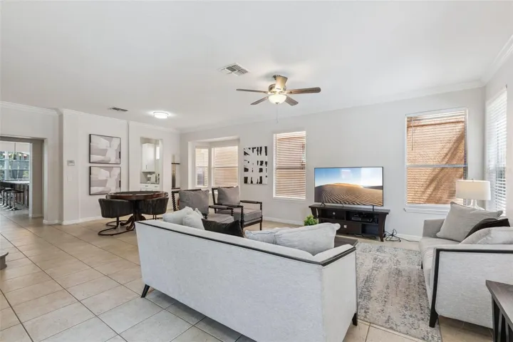 Font living room with poker and bumper-pool table, tv and entertainment space