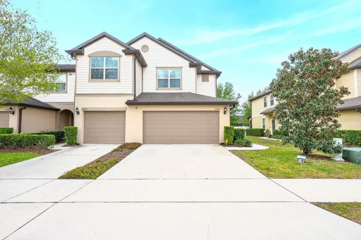 Welcome to this BEAUTIFULLY MAINTAINED END-UNIT townhome in the GATED COMMUNITY of Emerson North in Apopka, offering over 1,700 SQUARE FEET of stylish and functional living space.