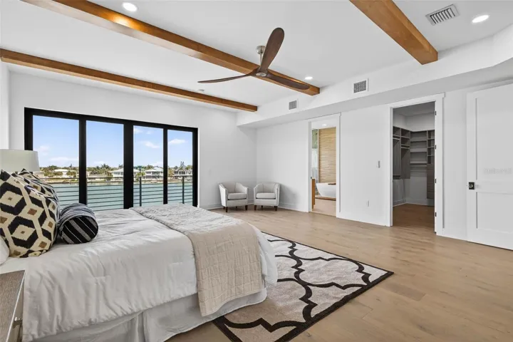Primary bedroom with dual walk-in closets.