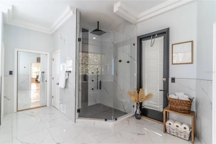 Walk-in shower with multiple showerheads