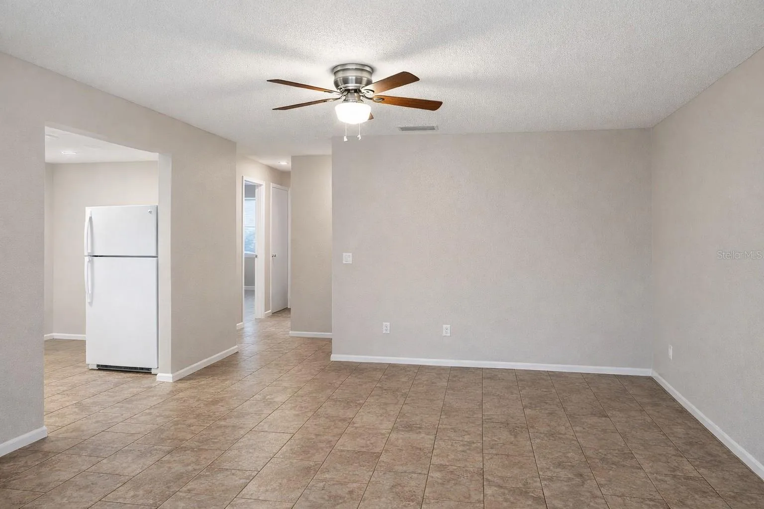 Open-concept living room with tall ceilings