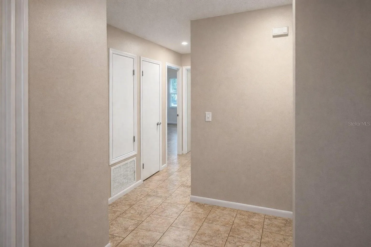 Hallway with additional storage closets