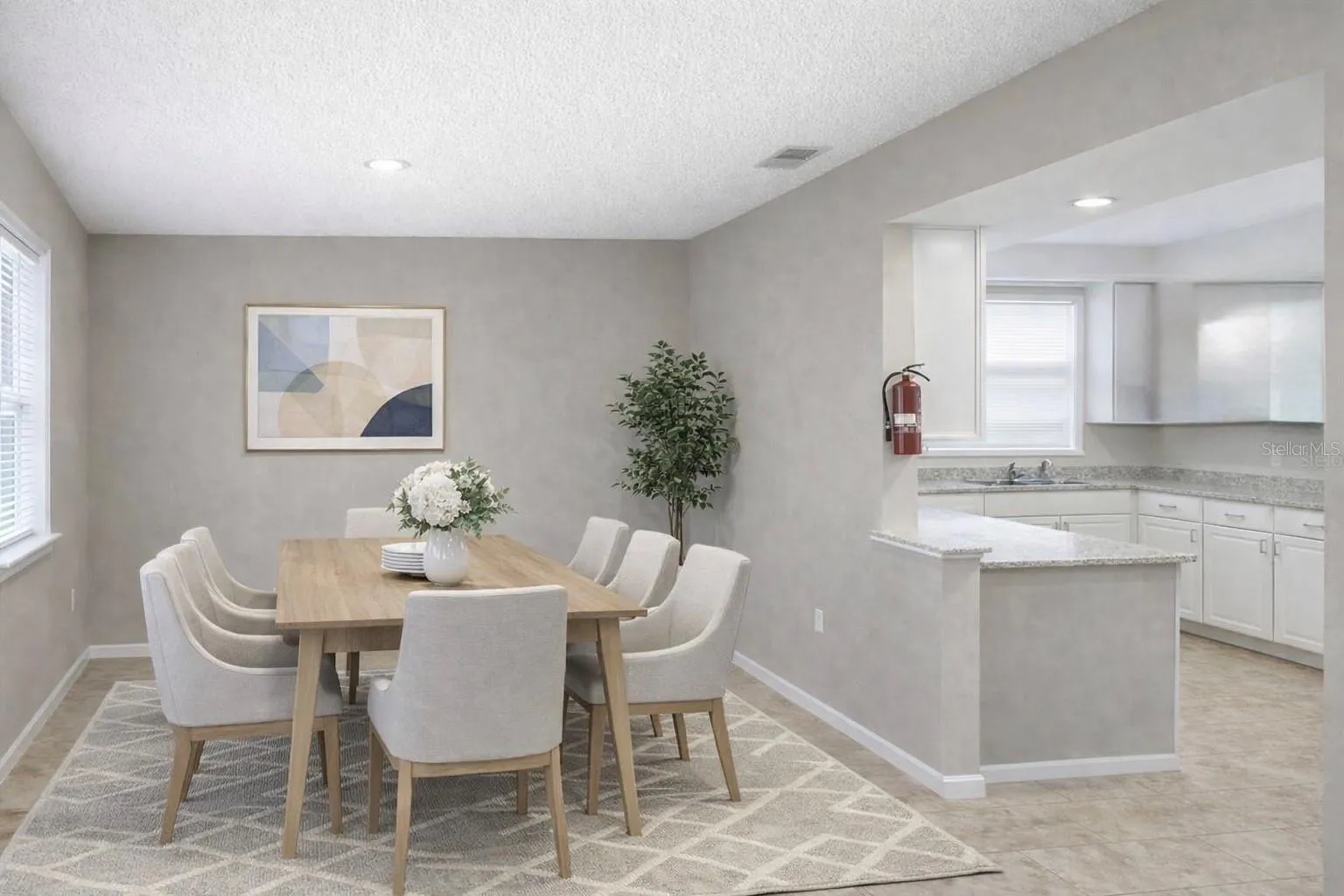Modern dining area with clean lines, natural light, and direct connection to the kitchen