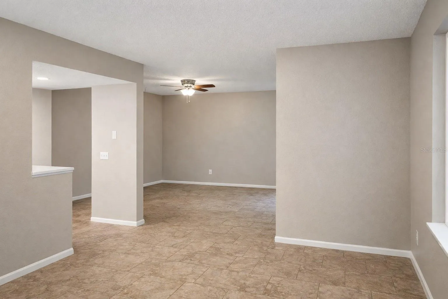 Dining area opening to spacious living room