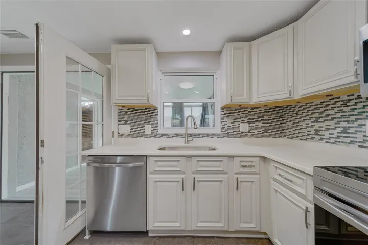 Wood Cabinetry and stylish backsplash