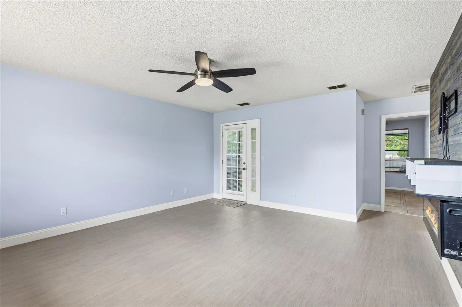 Living room with access to back screened-in porch