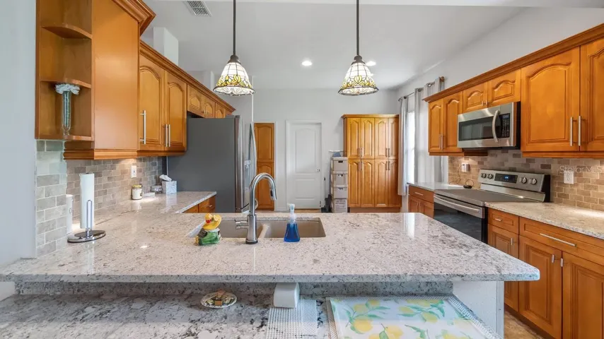 Kitchen With Pendant Lighting and Under Cabinet Lighting