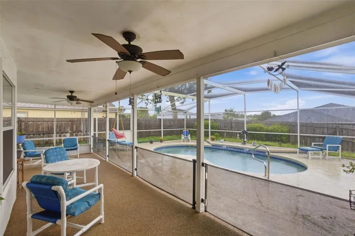 covered & screened pool patio area