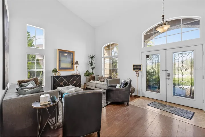 Double glass front entry doors opne to formal living room