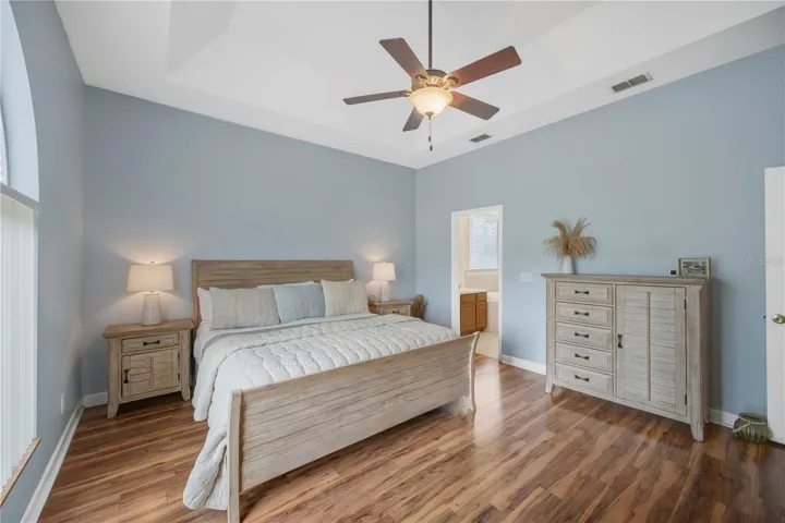 Primary bedroom with en-suite bath is on a first floor wing separate from the secondary bedrooms for privacy.