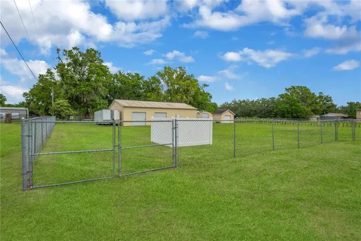 This property features an incredible 1,500 sq ft detached garage/workshop. Complete with two roll-up doors, a separate single-door entry and another 12x16 detached shed with a roll-up door on a concrete slab within fenced yard with a double gate access.