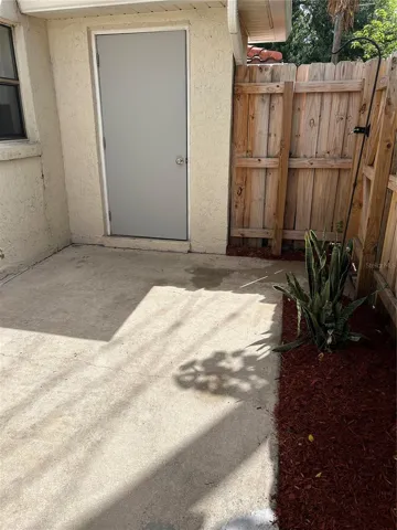 Backyard patio with outside storage area
