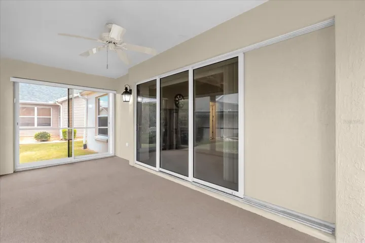 Light-filled lanai offering seamless indoor-outdoor living with sliding doors that open to a private outdoor terrace.