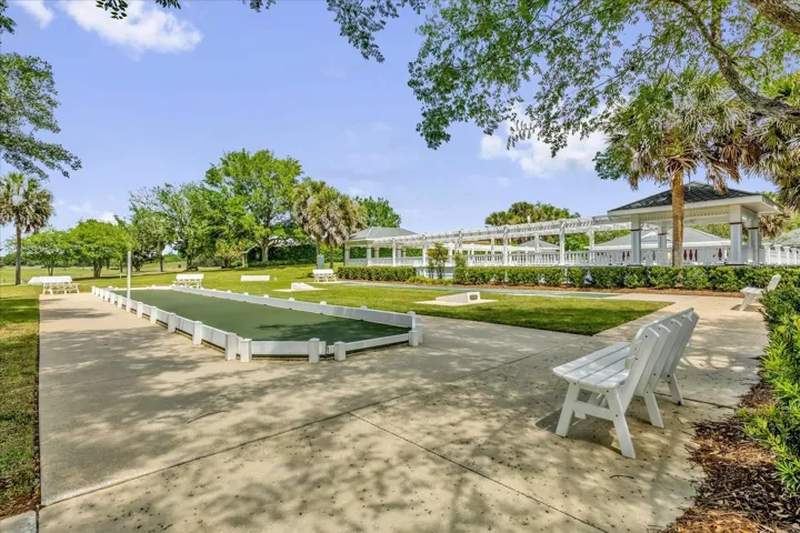 Liberty Park Recreation Area featuring bocce courts, shaded seating, and beautifully maintained grounds.