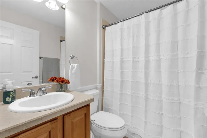 Well-maintained guest bathroom offering comfort and convenience for family and visitors.