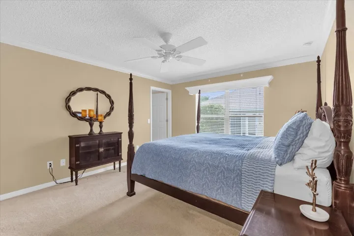 Spacious primary suite offering a peaceful and private retreat at the end of the day.