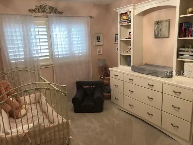 PHOTO SHOWS THE BEDROOM 3 PRIOR TO A WALL REMOVAL THAT CREATED ONE LARGE PRIMARY BEDROOM.