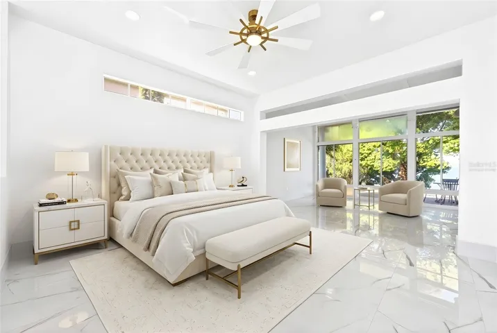 The main floor owner's suite has a gorgeous en-suite bath, dressing area, sitting area and lake views! Virtually Staged.