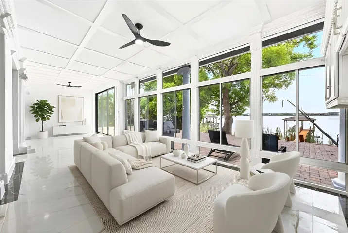 A wall of windows and breathtaking views of Black Lake! Virtually Staged.