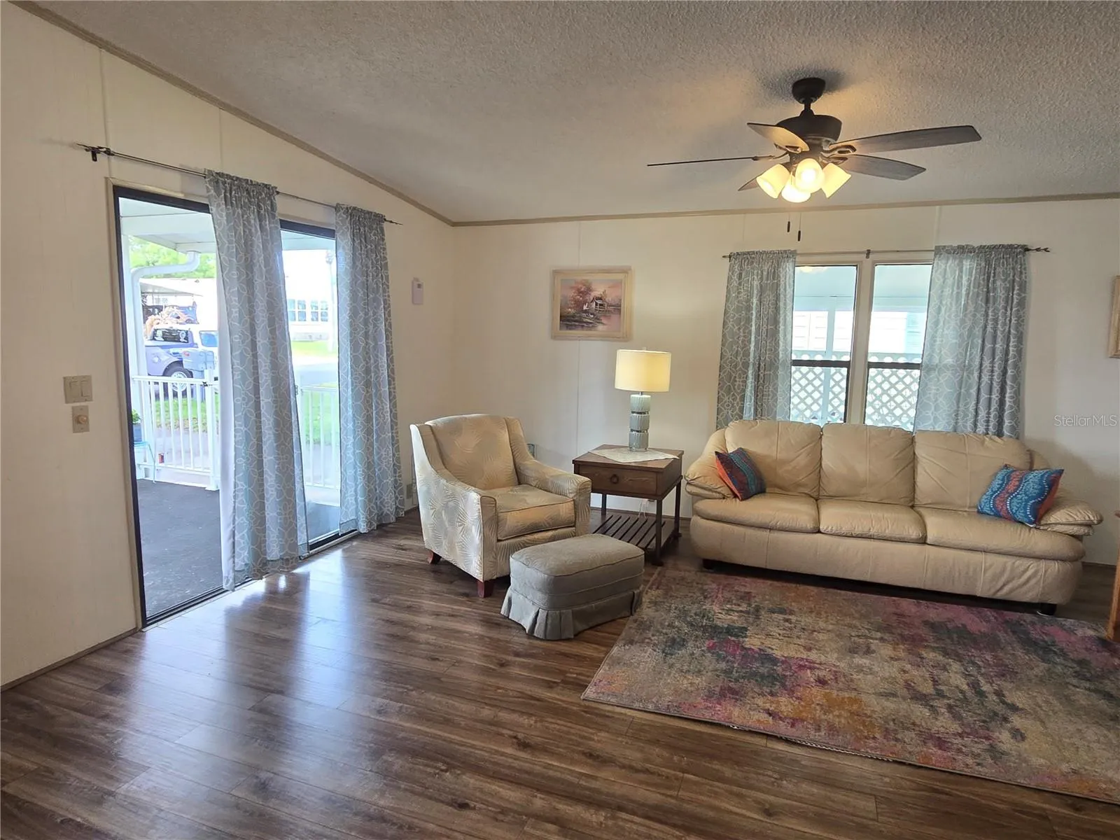 Living room entry is sliding doors from porch