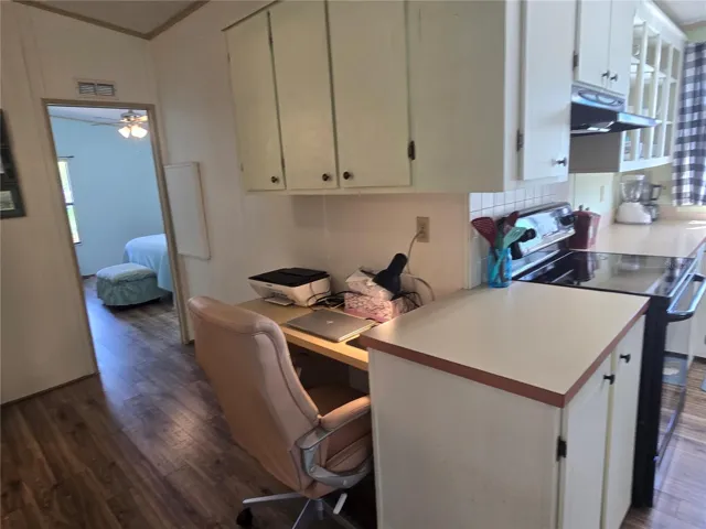 Office is tucked in "hallway" room