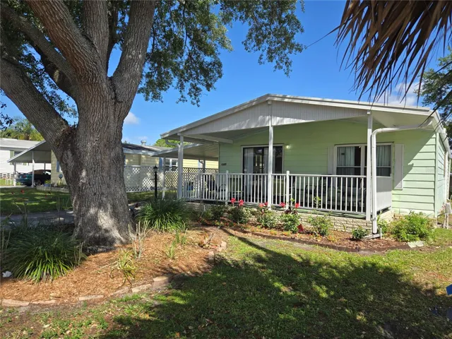Delightful front porch and beautiful garden